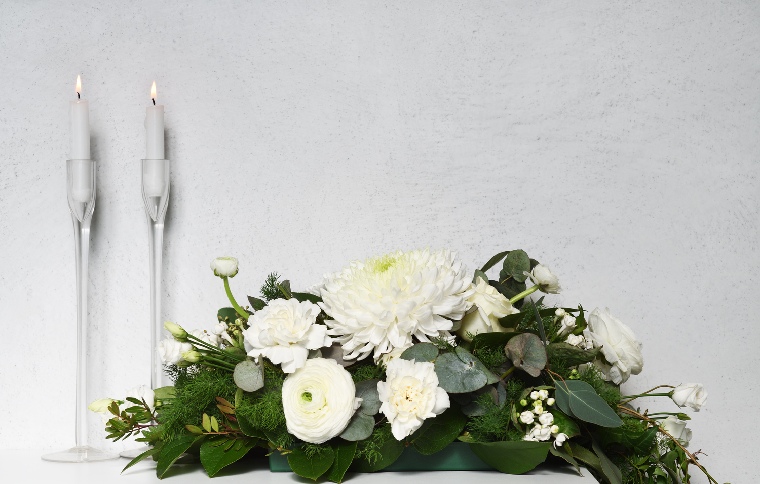 White floral composition with candles
